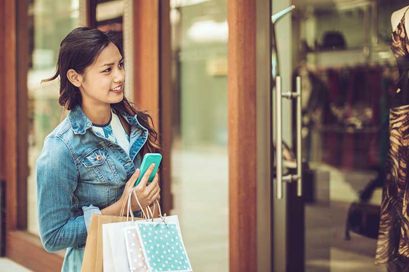 Woman browsing through a store window